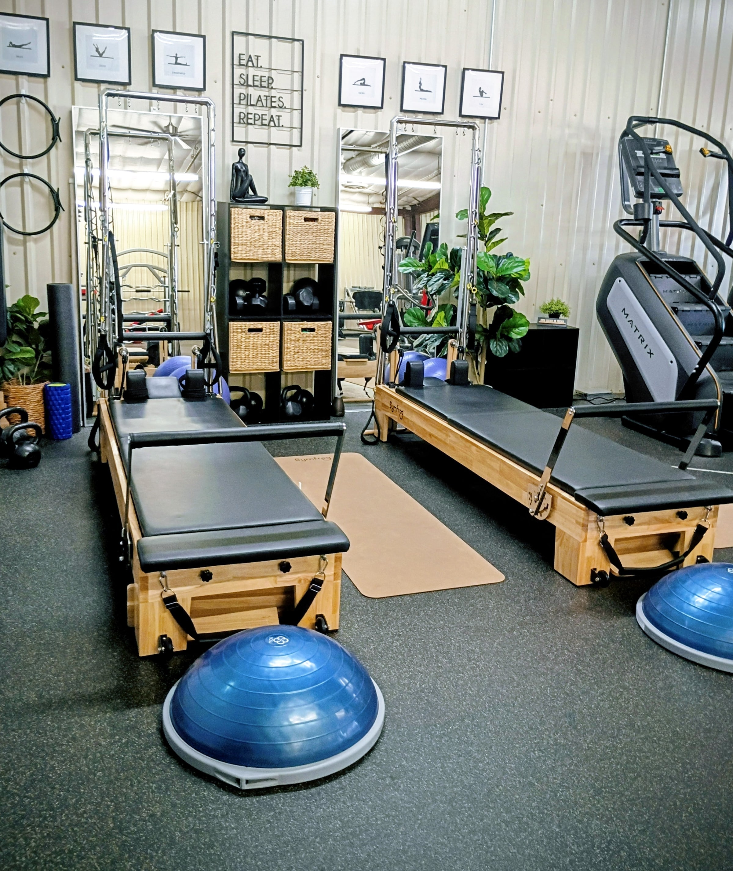 Pilates reformer machines lined up in the Paloma Wellness Studio